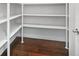 Walk-in pantry with white shelving and ample storage space for all your needs at 2010 Otters Pond Rd, Fruitland Park, FL 34731