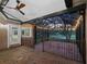 Relaxing screened-in patio with brick flooring, overhead lighting, and scenic views at 2010 Otters Pond Rd, Fruitland Park, FL 34731