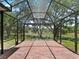Screened patio offering peaceful views of pond and trees at 2010 Otters Pond Rd, Fruitland Park, FL 34731