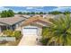 A nice aerial view of a well-maintained single-Gathering home with a two-car garage at 2095 Thornton Ter, The Villages, FL 32162