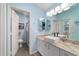 Bathroom featuring modern vanity, stone floors, and ample light at 2095 Thornton Ter, The Villages, FL 32162
