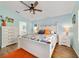 Relaxing bedroom featuring neutral walls, a ceiling fan, and natural light from windows at 2095 Thornton Ter, The Villages, FL 32162