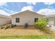 Home exterior featuring tidy landscaping, including small bushes and rocks at 2095 Thornton Ter, The Villages, FL 32162