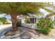 Attractive home featuring a two-car garage, well-manicured landscaping, and sidewalk at 2095 Thornton Ter, The Villages, FL 32162