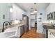 Well-equipped kitchen featuring stainless steel appliances and convenient laundry area at 2095 Thornton Ter, The Villages, FL 32162