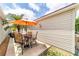 Outdoor patio with furniture, a seating area, and a vibrant palm tree nearby at 2095 Thornton Ter, The Villages, FL 32162