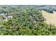 Aerial view of a property with red boundary lines, showcasing a lush, wooded lot at 2420 Sr 471, Sumterville, FL 33585