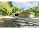 Charming home exterior featuring a screened-in patio, neutral siding, and well-kept backyard space at 2420 Sr 471, Sumterville, FL 33585