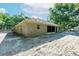 The backyard boasts a screened patio, neutral siding, complemented by a spacious and maintained lawn at 2420 Sr 471, Sumterville, FL 33585