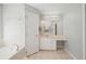 This bathroom features tile floors, a large vanity with drawers, and a soaking tub at 2420 Sr 471, Sumterville, FL 33585