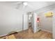 Bright bedroom featuring wood floors and featuring a closet, with an ensuite bathroom view at 2420 Sr 471, Sumterville, FL 33585