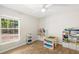 Bedroom with natural light from a large window and featuring ample space for play and storage at 2420 Sr 471, Sumterville, FL 33585