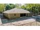 Back exterior view of home with chain-link fence at 2420 Sr 471, Sumterville, FL 33585