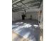 Garage interior features a large open layout with an epoxy floor at 2420 Sr 471, Sumterville, FL 33585
