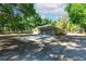A charming property with a spacious garage and driveway, surrounded by lush greenery, offering convenience at 2420 Sr 471, Sumterville, FL 33585