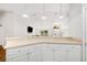 Modern kitchen overlooking the living room showcasing an open-concept layout, perfect for entertaining at 2420 Sr 471, Sumterville, FL 33585