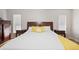 Bright main bedroom with hardwood floors and a large bed, perfect for relaxation at 2420 Sr 471, Sumterville, FL 33585