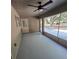 Spacious screened porch featuring a ceiling fan and view of backyard at 2420 Sr 471, Sumterville, FL 33585