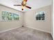 Bedroom offering carpet floors, natural light, a ceiling fan and a comfortable atmosphere at 25519 Colmar Ave, Sorrento, FL 32776