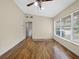 Comfortable living room with hardwood floors, neutral paint, and access to other rooms at 25519 Colmar Ave, Sorrento, FL 32776