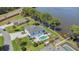 Beautiful home overlooking the water, a private pool, meticulous landscaping, and inviting outdoor spaces at 26516 Savage Cir, Howey In The Hills, FL 34737