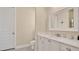 Bathroom featuring a white marble countertop, white cabinets, and toilet at 26516 Savage Cir, Howey In The Hills, FL 34737