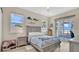 Charming bedroom with water views, complemented by stylish decor and soft furnishings at 26516 Savage Cir, Howey In The Hills, FL 34737
