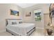 Bedroom showcasing a queen bed, neutral decor, and natural light at 26516 Savage Cir, Howey In The Hills, FL 34737