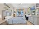 Bedroom showcasing desk, bed, dresser, and view from sliding glass door at 26516 Savage Cir, Howey In The Hills, FL 34737