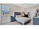 Bedroom featuring a window, and personal items on shelving at 26516 Savage Cir, Howey In The Hills, FL 34737