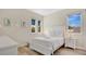 Bright bedroom featuring a white color scheme with soft hues and three large windows at 26516 Savage Cir, Howey In The Hills, FL 34737