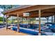 Boat lift with boat, TV, and lighting, a luxurious amenity on the lake at 26516 Savage Cir, Howey In The Hills, FL 34737
