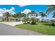 Beautiful two-story home with a long brick driveway and a three-car garage at 26516 Savage Cir, Howey In The Hills, FL 34737