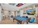 Bright, spacious game room featuring a pool table, fun decor, and ample space at 26516 Savage Cir, Howey In The Hills, FL 34737