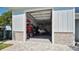 Spacious garage with ample storage, including a boat, and a convenient access to the outdoors at 26516 Savage Cir, Howey In The Hills, FL 34737