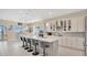 Bright open kitchen with a center island, modern appliances, and a view of the lake at 26516 Savage Cir, Howey In The Hills, FL 34737