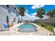 Relaxing pool with a spa, surrounded by a fence and lush landscaping, offering a private oasis at 26516 Savage Cir, Howey In The Hills, FL 34737