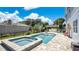 Sparkling pool and spa surrounded by a large patio, perfect for relaxation and entertainment at 26516 Savage Cir, Howey In The Hills, FL 34737