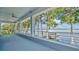 Covered porch providing gorgeous views of the lake and private boat dock at 26516 Savage Cir, Howey In The Hills, FL 34737