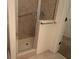 Tiled shower stall with glass door and chrome fixtures at 292 Nautica Mile Dr, Clermont, FL 34711