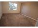 Comfortable bedroom with soft carpet, window view, and neutral paint at 292 Nautica Mile Dr, Clermont, FL 34711
