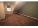 Cozy bedroom featuring plush carpeting, a window and a unique slanted ceiling at 292 Nautica Mile Dr, Clermont, FL 34711