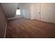 Neutral bedroom with carpeting, window, and white doors, offering a bright space at 292 Nautica Mile Dr, Clermont, FL 34711