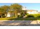 Charming community clubhouse featuring manicured landscaping, beautiful shrubbery, and an inviting entrance at 292 Nautica Mile Dr, Clermont, FL 34711