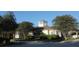 Charming community clubhouse featuring beautiful trees and landscaping, an inviting entryway, and bright exterior at 292 Nautica Mile Dr, Clermont, FL 34711