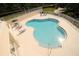 Inviting pool area with lounge chairs for relaxation, perfect for soaking up the sun in a serene setting at 292 Nautica Mile Dr, Clermont, FL 34711