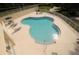 Inviting pool area with lounge chairs for relaxation, perfect for soaking up the sun in a serene setting at 292 Nautica Mile Dr, Clermont, FL 34711
