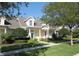 Charming single-Gathering home with well-manicured lawn, inviting walkway, and beautiful landscaping at 292 Nautica Mile Dr, Clermont, FL 34711