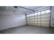Spacious garage with a large windowed door providing plenty of natural light at 292 Nautica Mile Dr, Clermont, FL 34711