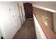 Hallway with carpet and neutral paint, complete with white doors and trim at 292 Nautica Mile Dr, Clermont, FL 34711